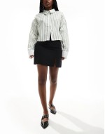 bengaline mini skirt with split detail in black