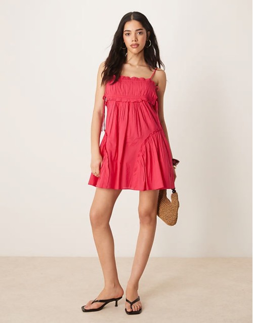 babydoll mini dress with ruffle hem in raspberry
