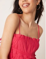 babydoll mini dress with ruffle hem in raspberry