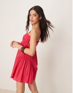 babydoll mini dress with ruffle hem in raspberry