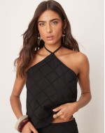 halter neck crop top and trousers co-ord with geo cutwork in black