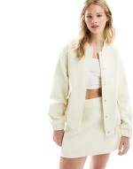 crochet bomber jacket and mini skirt co-ord in cream